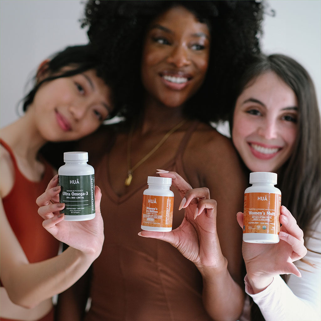 Group shot of women holding products from HUA Wellness
