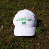 Photo of HUA's Go Touch Grass Hat lying on grass