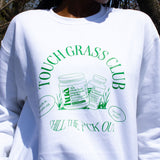 Closeup photo of Touch Grass Club sweatshirt