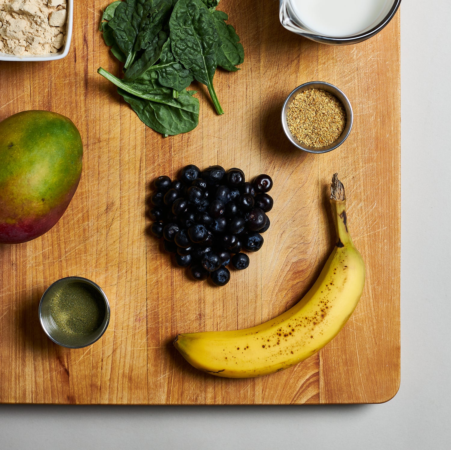 Flatlay photo of fruits on a cutting board